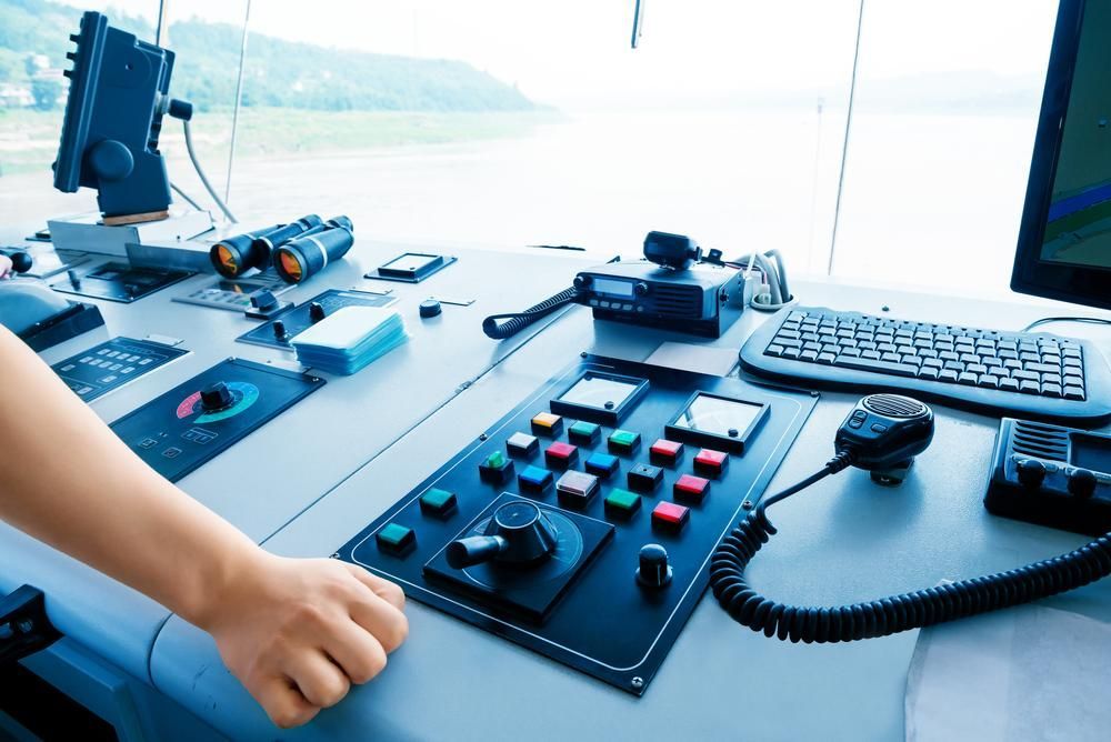 A Person Is Pressing A Button On A Control Panel — PASMA Electrical In Weipa, QLD