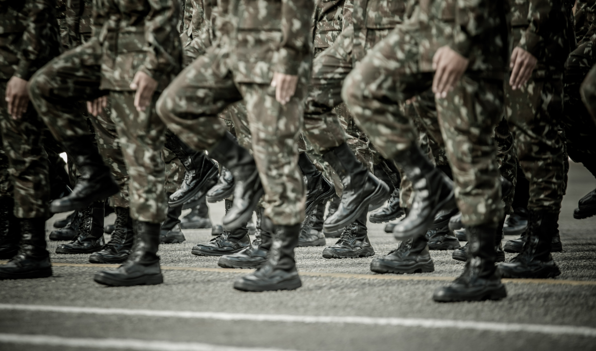 a group of soldiers are marching in a parade .