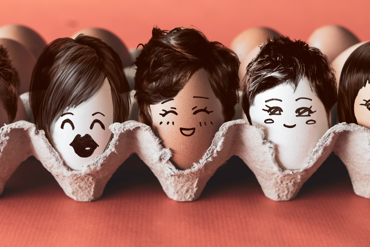 a row of eggs with faces drawn on them