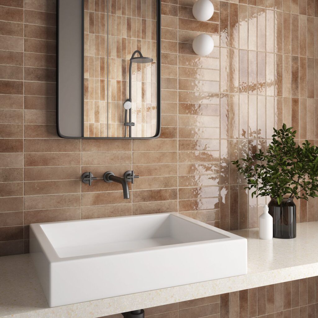 A Bathroom With Brown Tiles and a White Sink — Northern Tile Gallery in Winnellie, NT