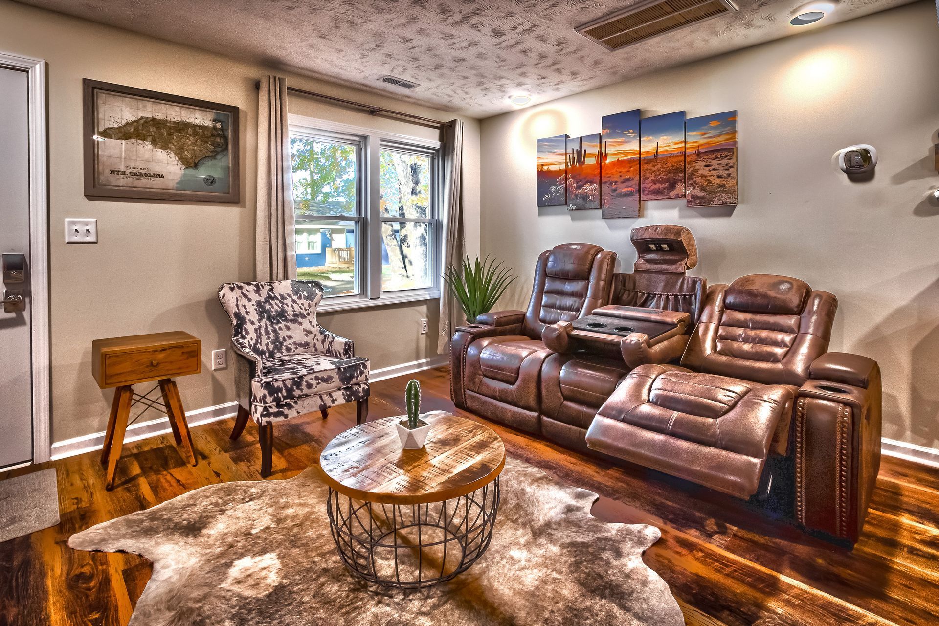 A living room with a couch , chair , and coffee table.