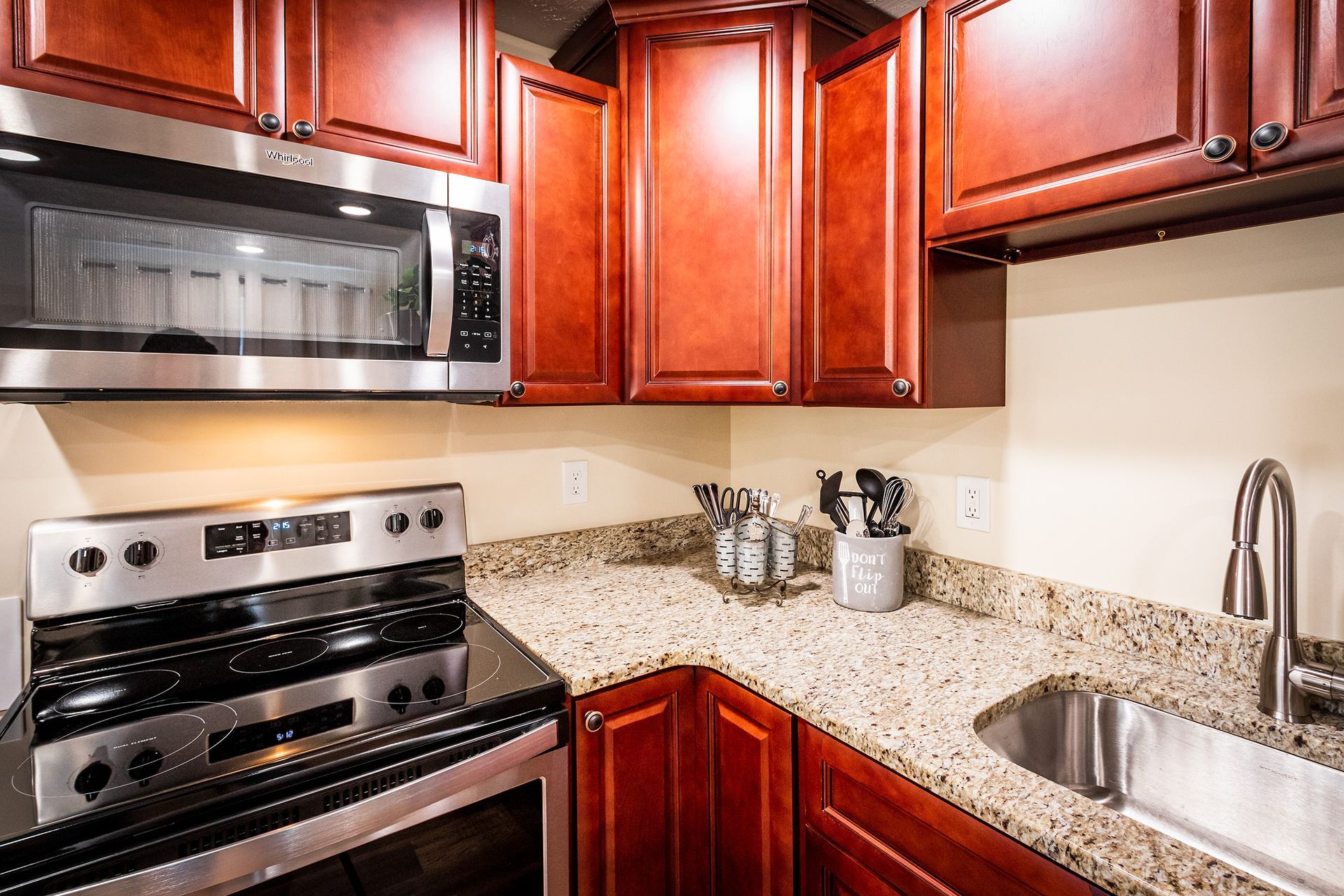 A kitchen with stainless steel appliances and granite counter tops