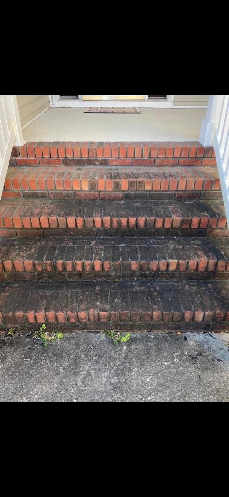 Grimy brick steps before power washing by a professional power washing company