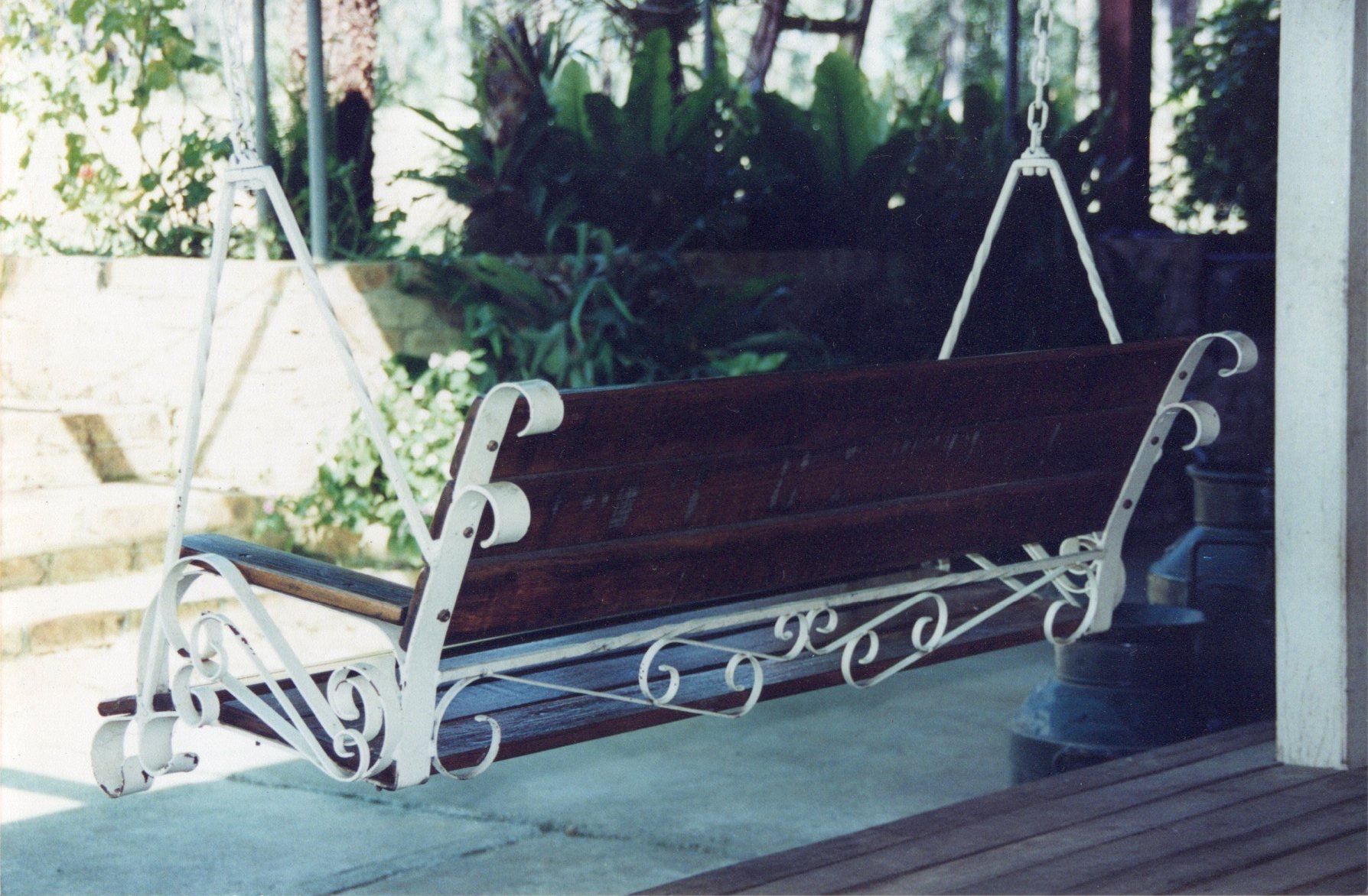 A wooden swing with the number 6 on it