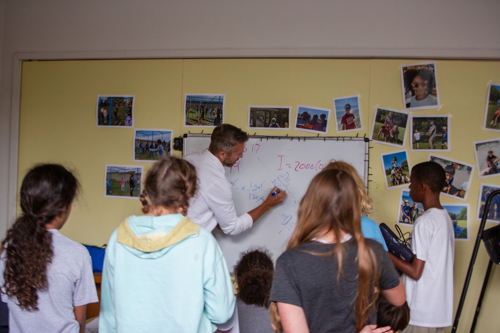 Milwaukee Montessori School students engaging in hands-on math activities.