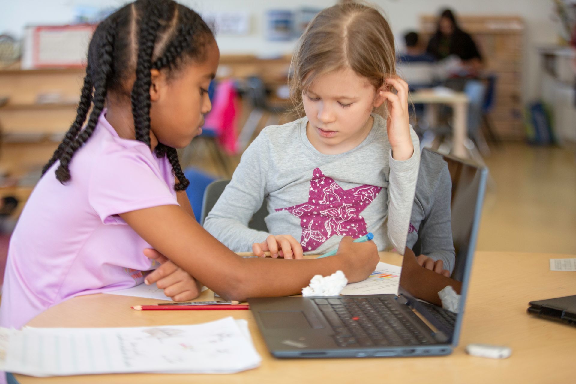 Anika works with a classmate in Ms. Arora's Lower Elementary Classroom at MMS