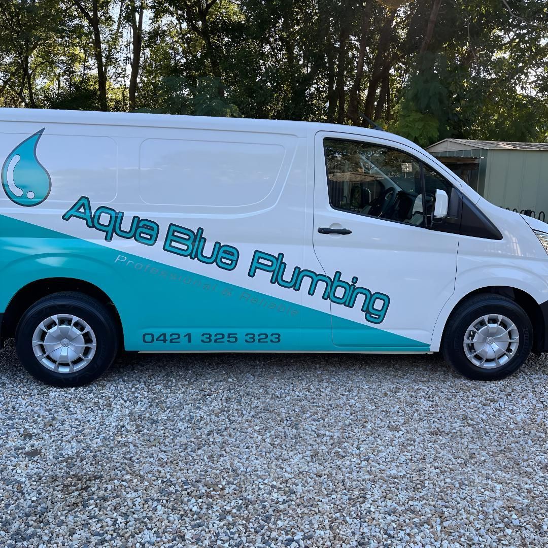 A Toilet Is Sitting in A Bathroom Next to A Shower — Aqua Blue Plumbing Services in Coffs Harbour, NSW 