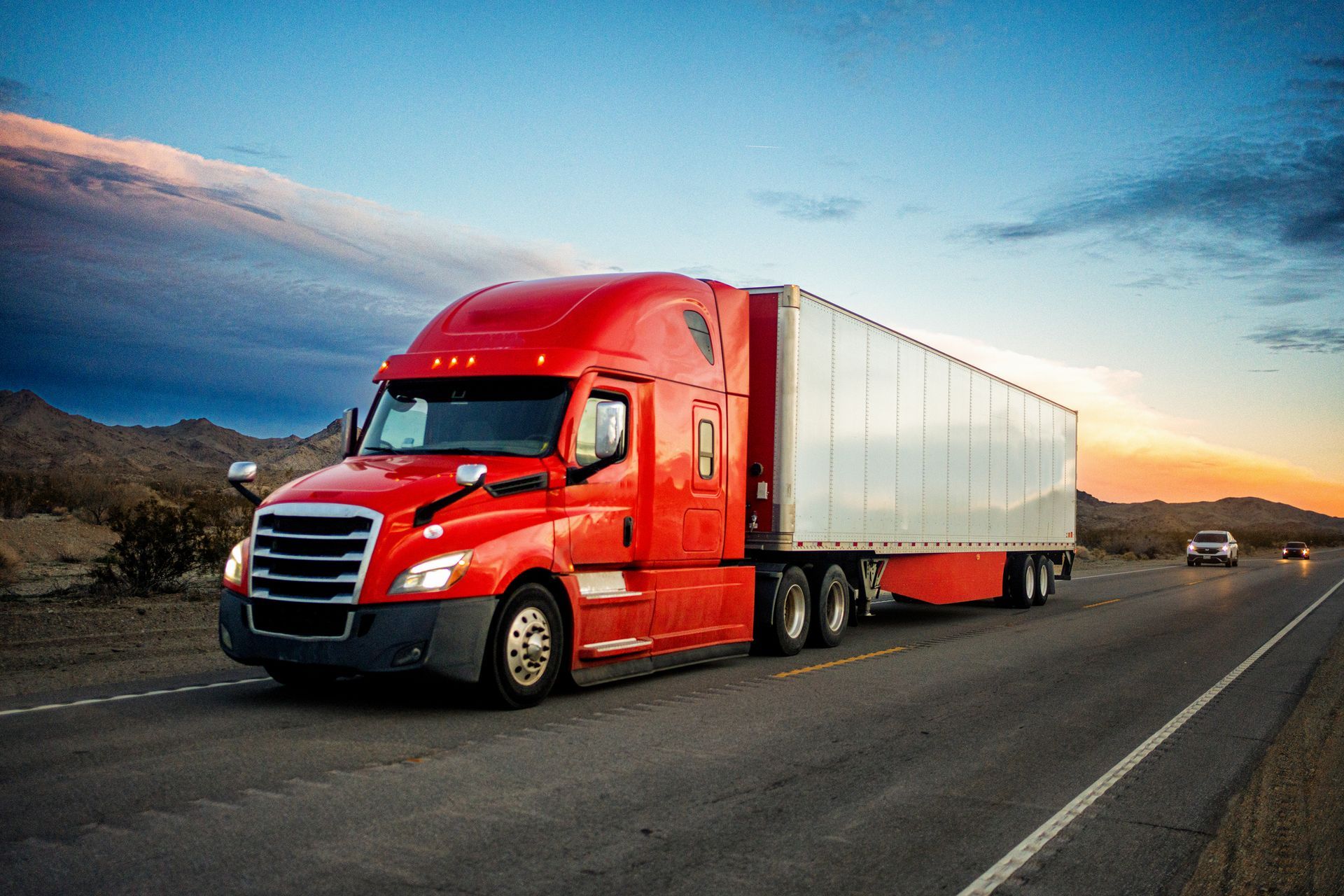 Truck Speeding on A Two-Lane Highway | Lafayette, LA | Paul's Towing & Roadservice Brightly Red Colored Semi-Truck Speeding on A Two-Lane Highway | Lafayette, LA | Paul's Towing & Roadservice