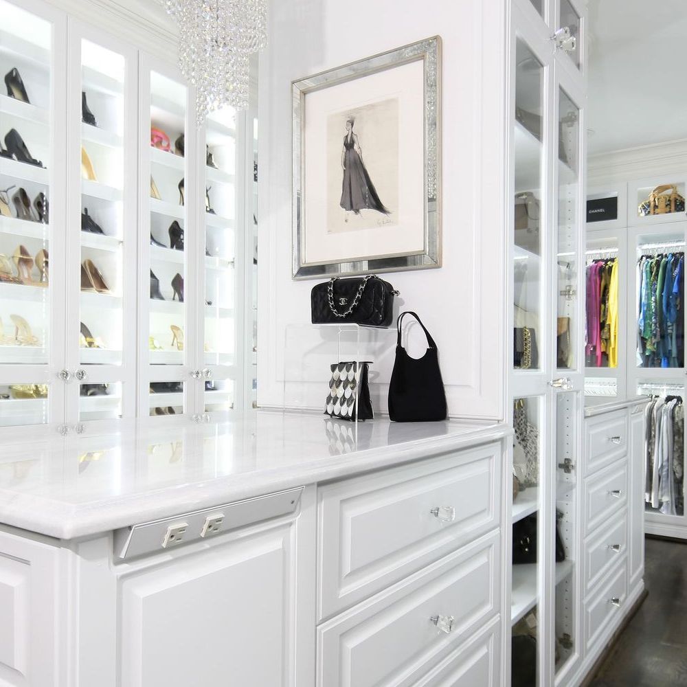 A closet with a picture of a woman on the wall