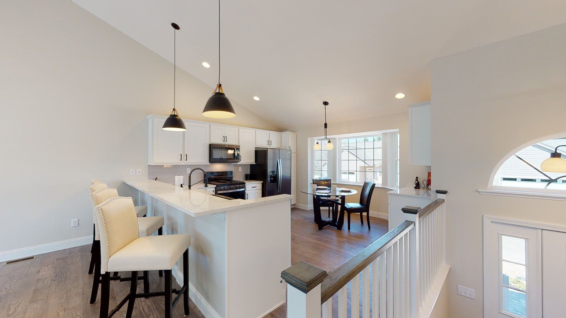 A 3d model of a kitchen and dining room in a house.