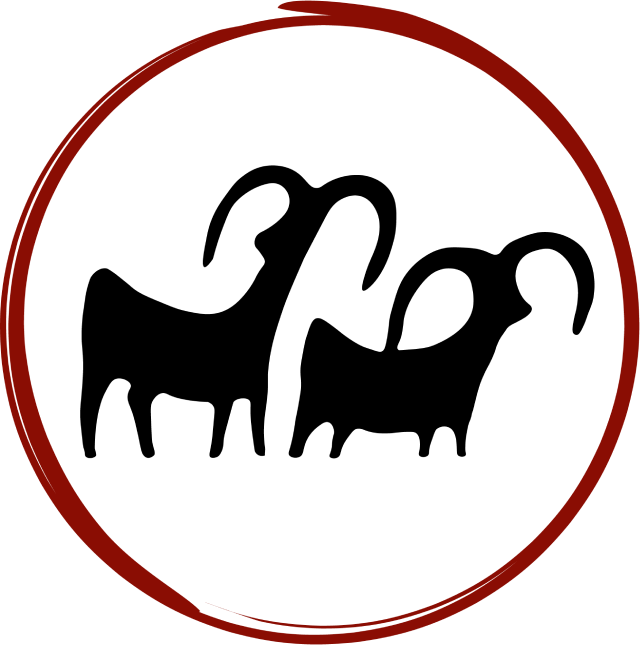 A silhouette of two goats with long horns in a red circle.