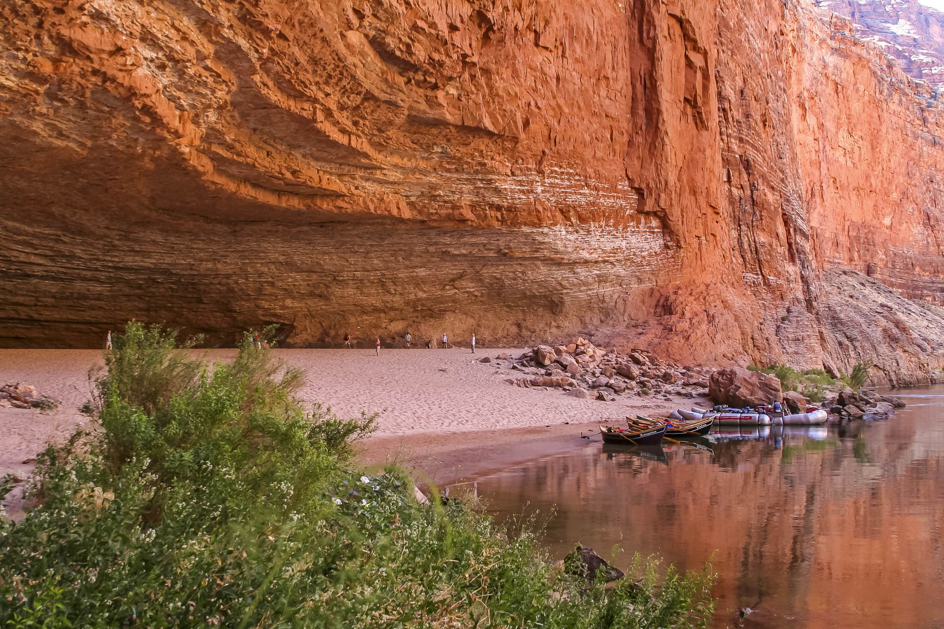 A body of water surrounded by rocks and trees
