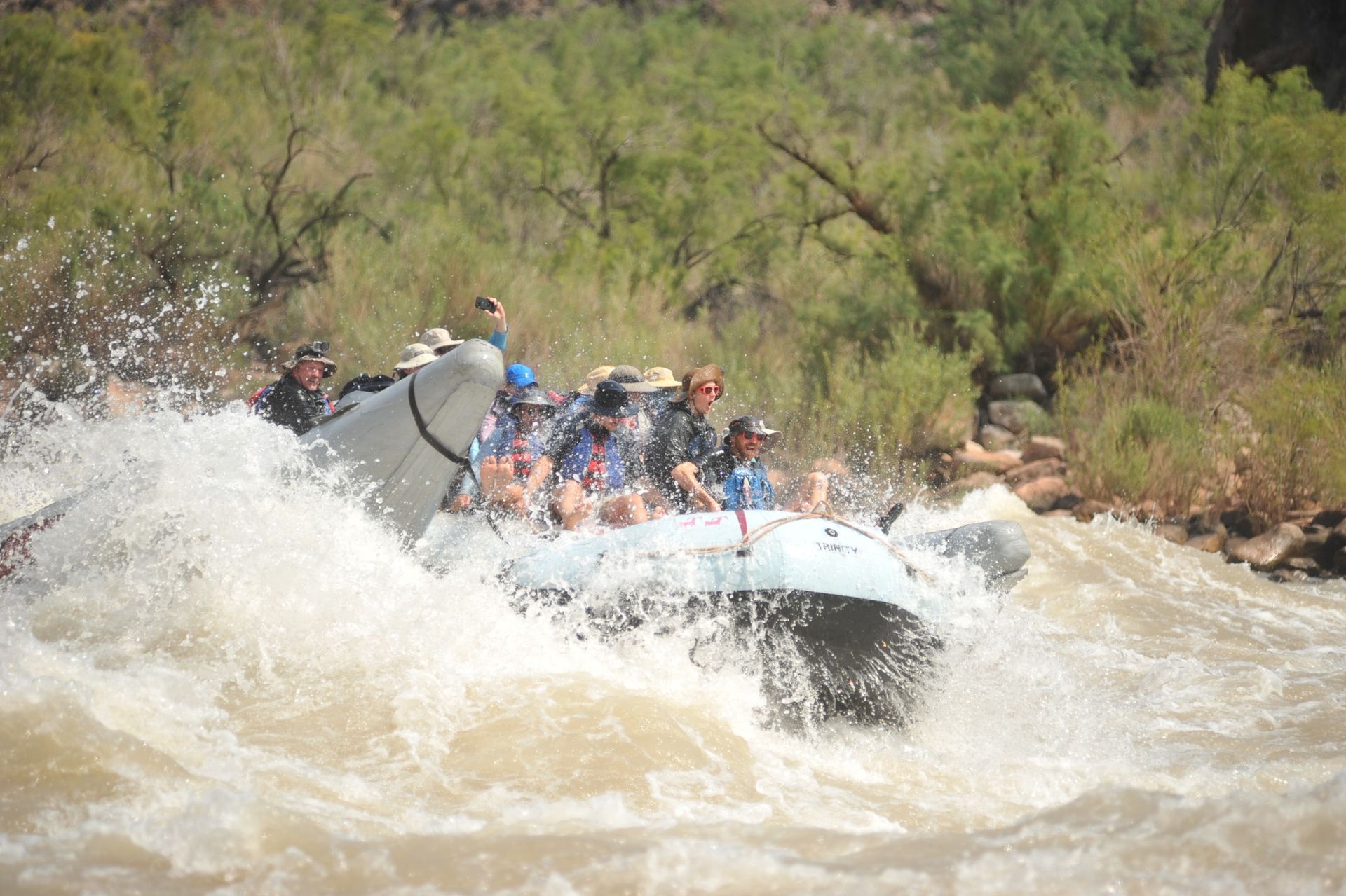 A group of people are rafting down a river