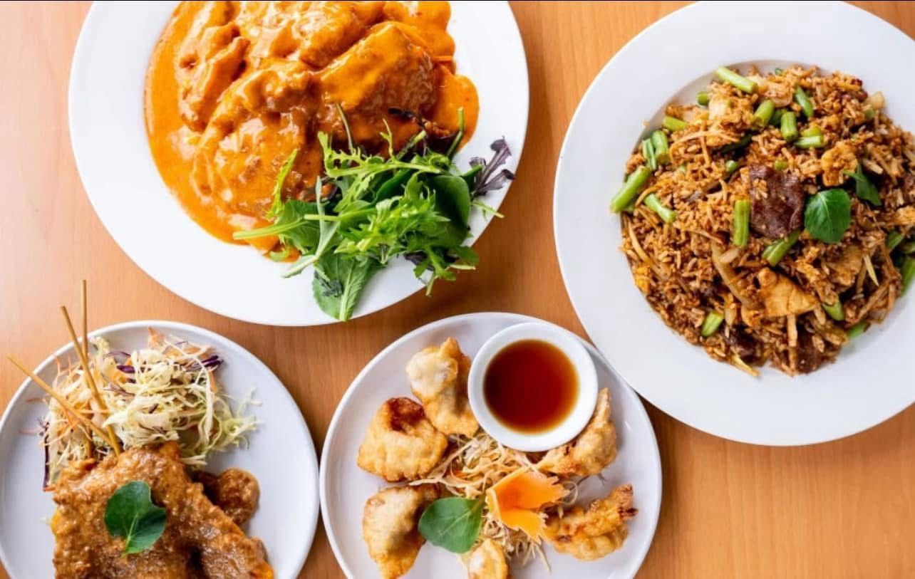 A close up of a plate of food with noodles and vegetables