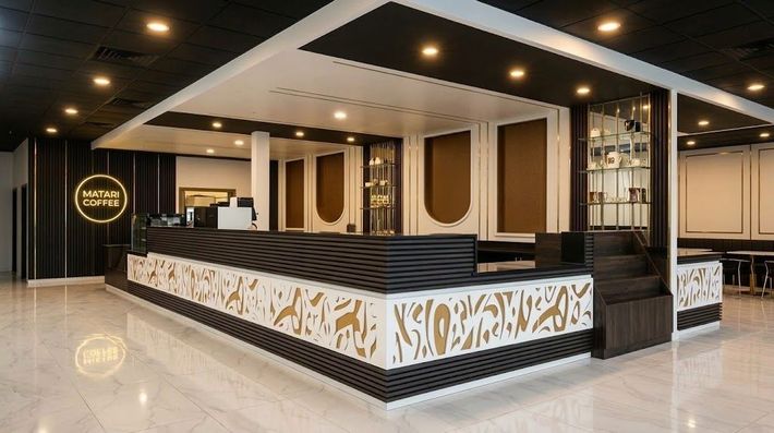 Modern hotel lobby with reception desk, black-and-white decor, gold accents, and polished marble floor