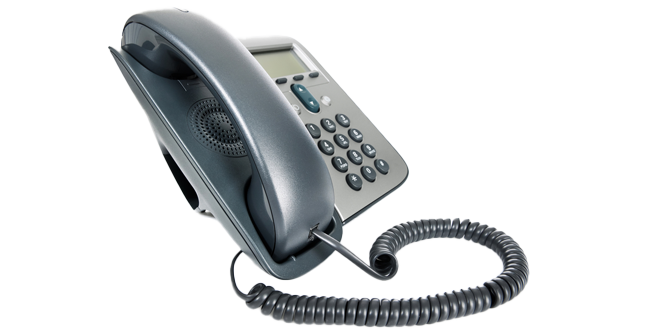 Black and gray corded office phone with keypad and coiled handset cord