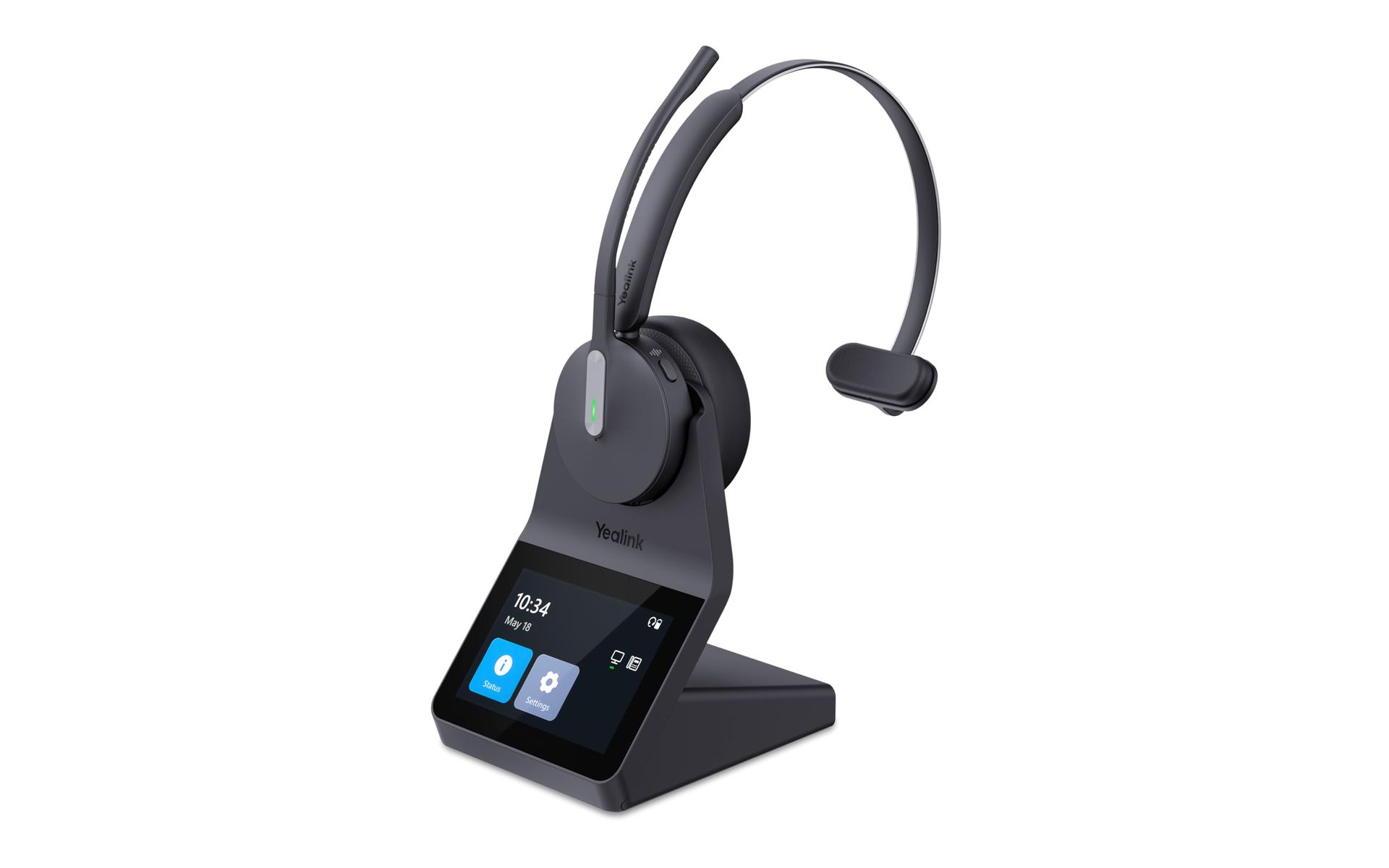 Black office headset on a charging stand with a small display screen