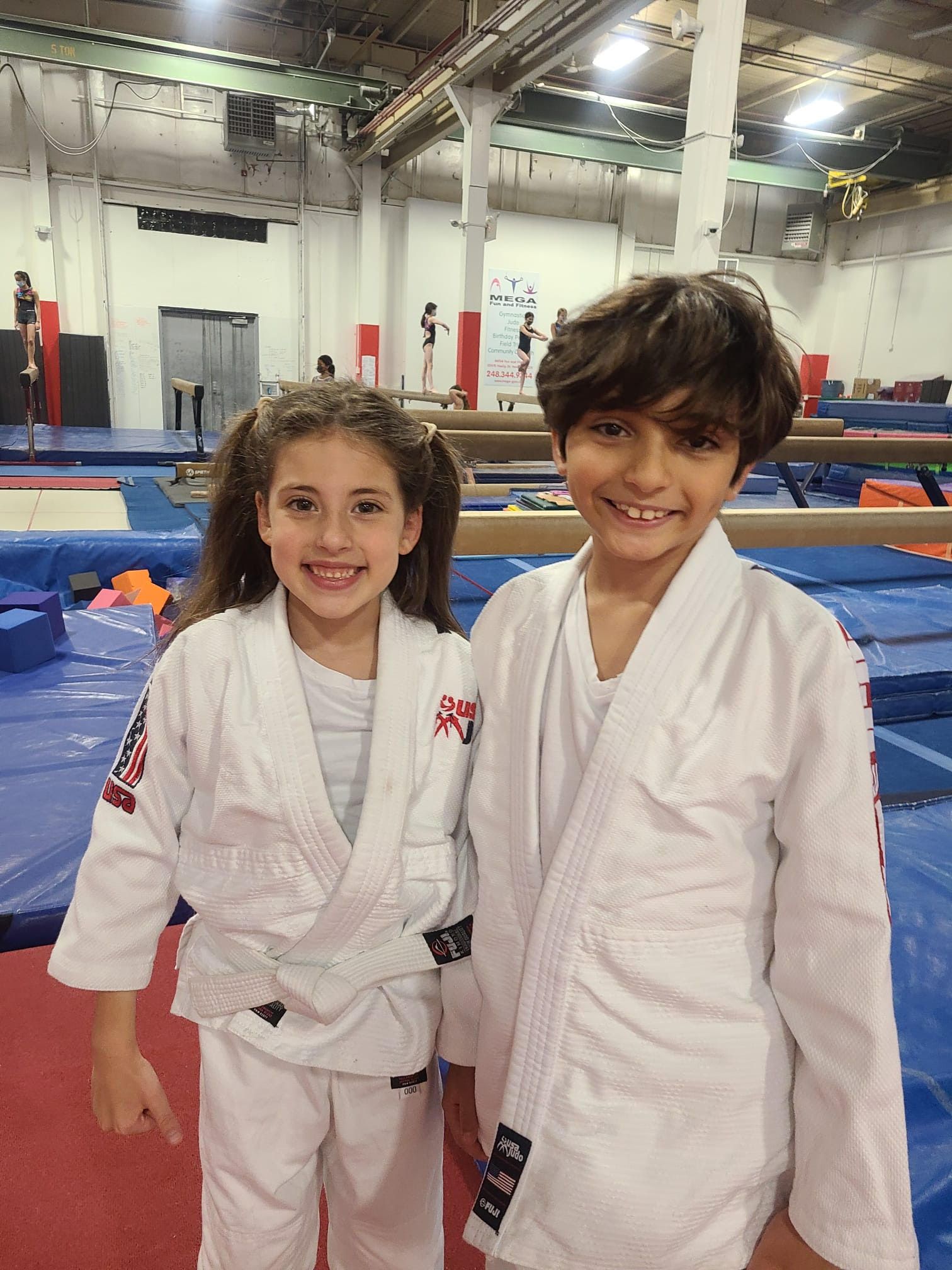 a group of young boys are practicing judo in a gym