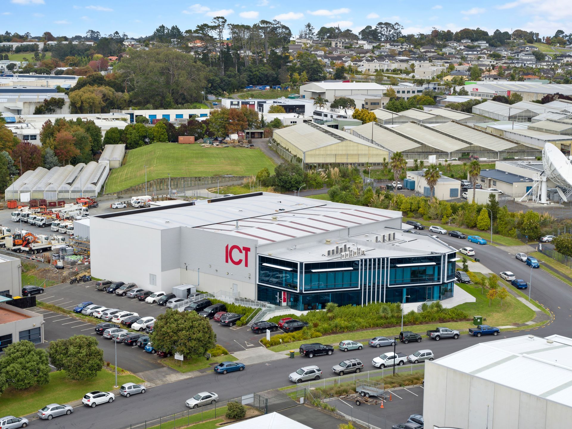 An aerial view of a large building with the word ict on it