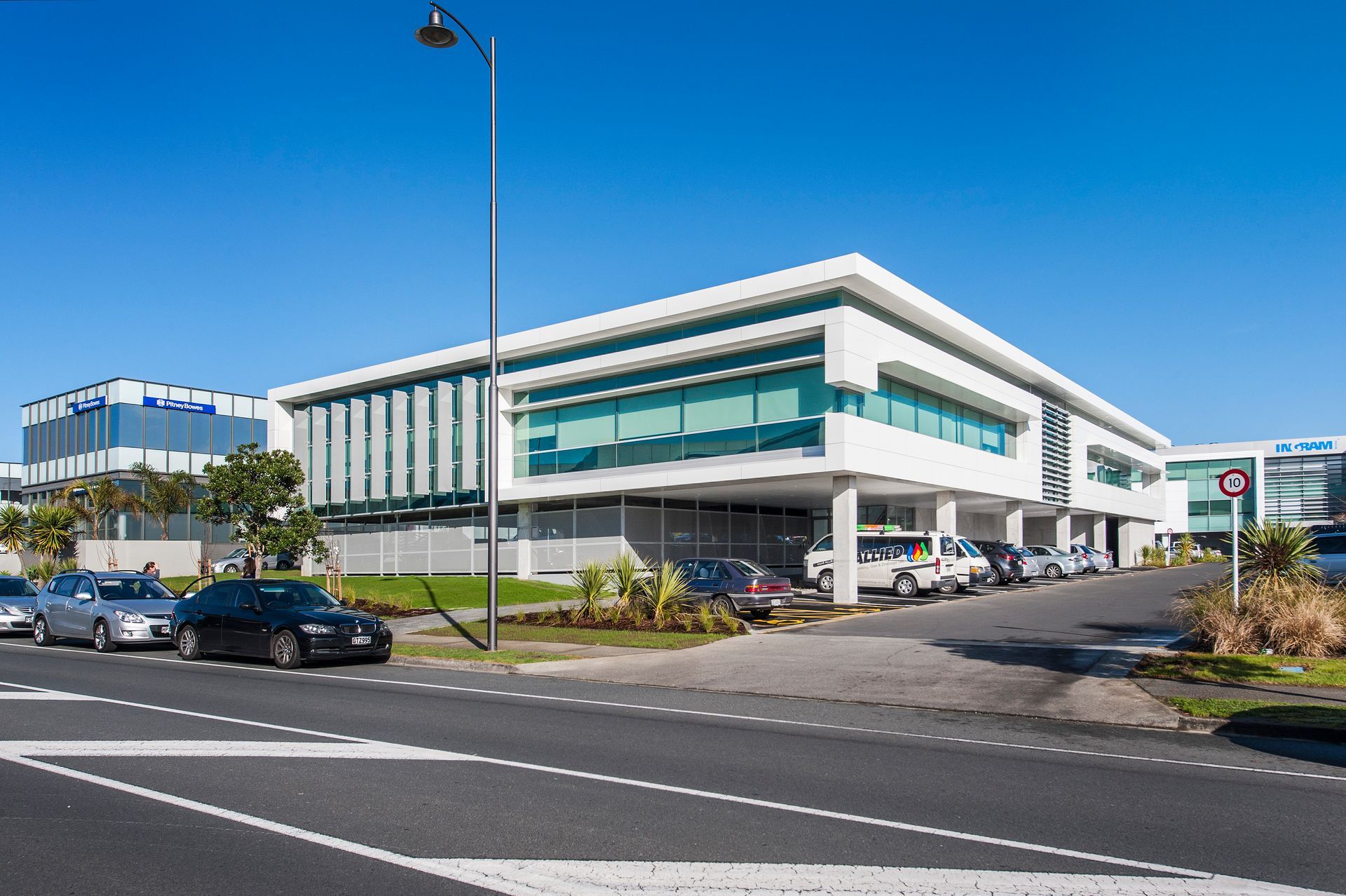 A large building with cars parked in front of it