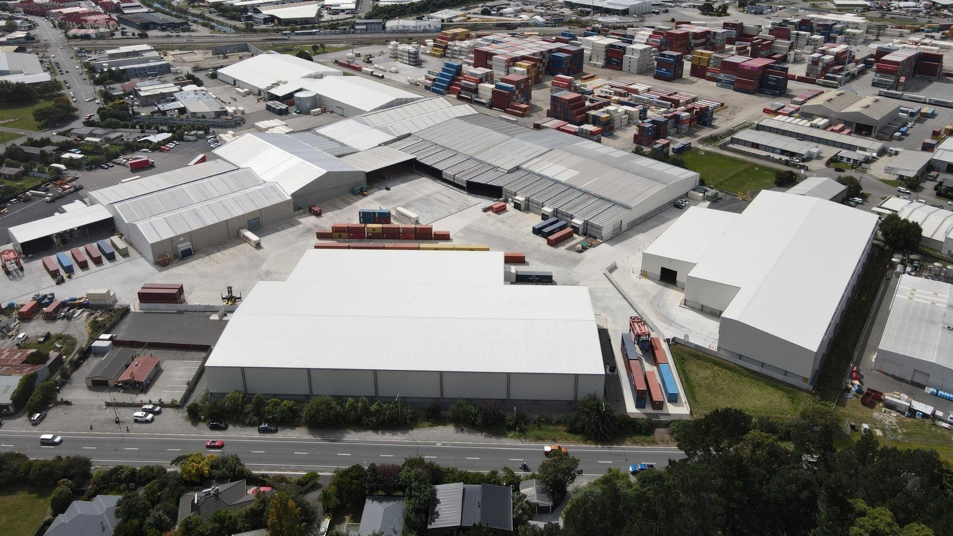 An aerial view of a large warehouse in a city.