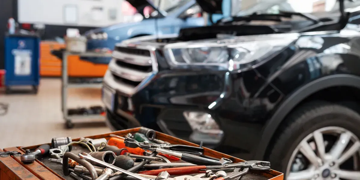 A Car Repair Shop with A SUV and Tools on A Workbench — Geelong Car Repair Centre in Newcomb, VIC
