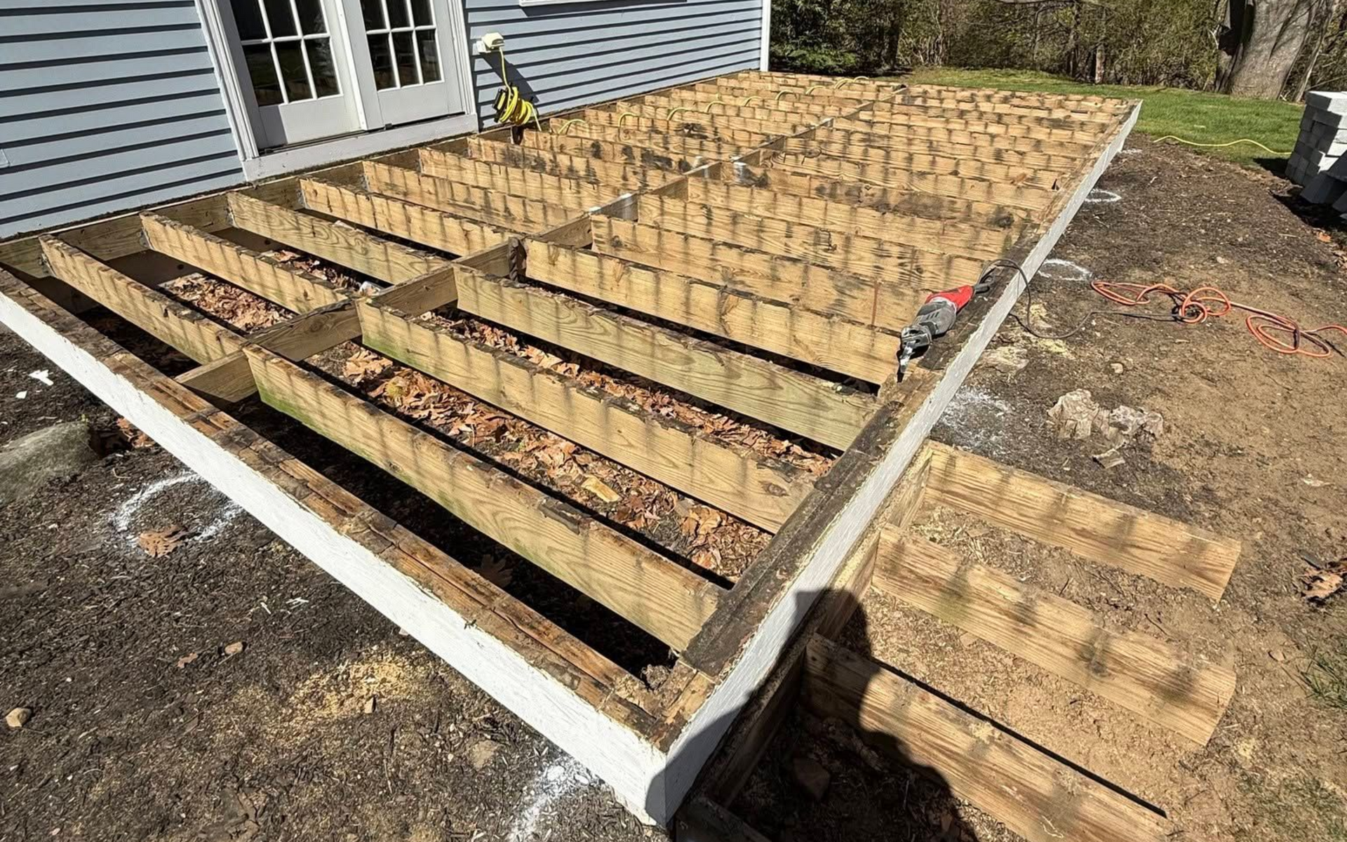 New pressure-treated deck frame being built during composite deck replacement in Marblehead MA by A-Z Finish Carpentry