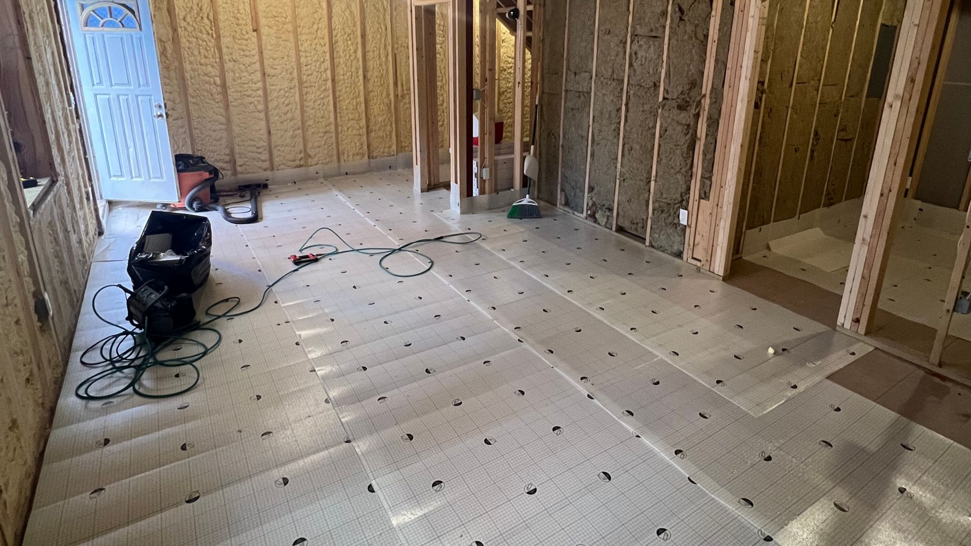 basement living room in Boston with LVP flooring