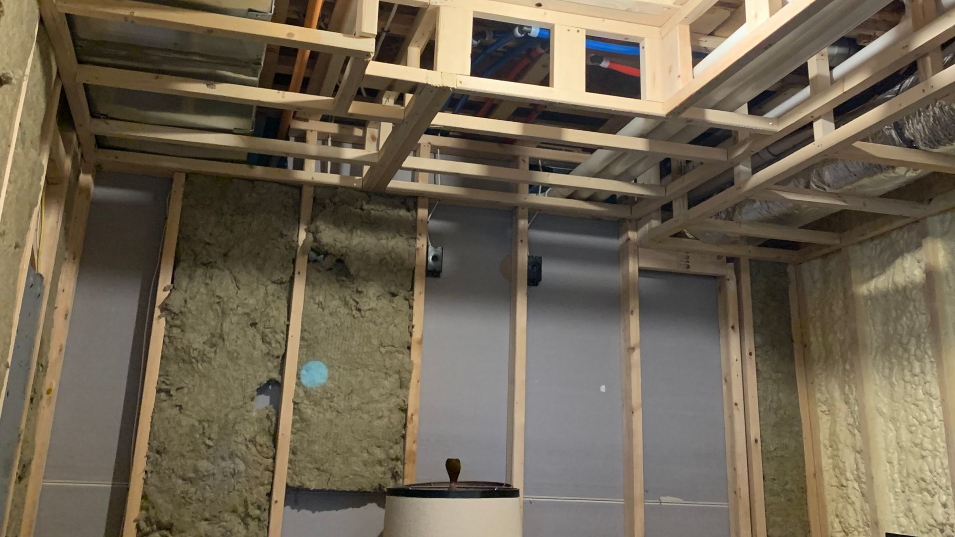 Boston basement r emodeling showing the studs