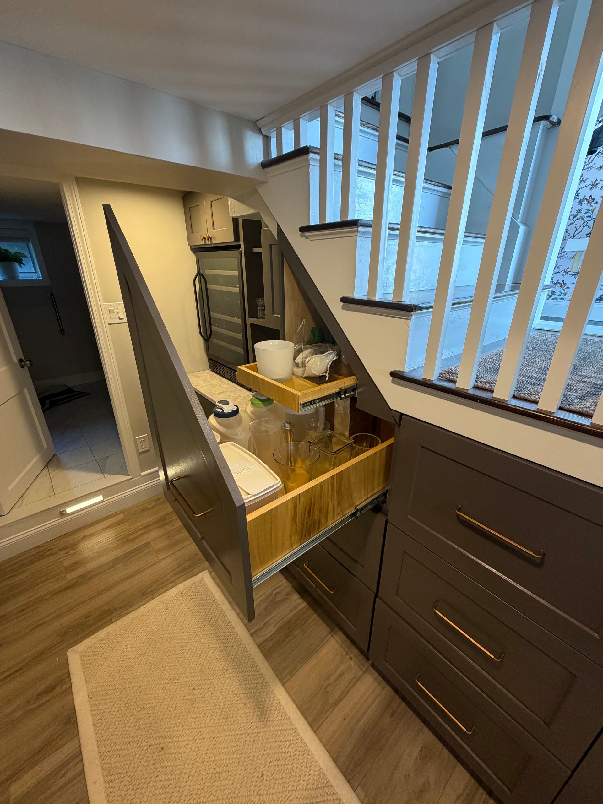 Install: Custom under-stair cabinets during installation by A-Z Finish Carpentry