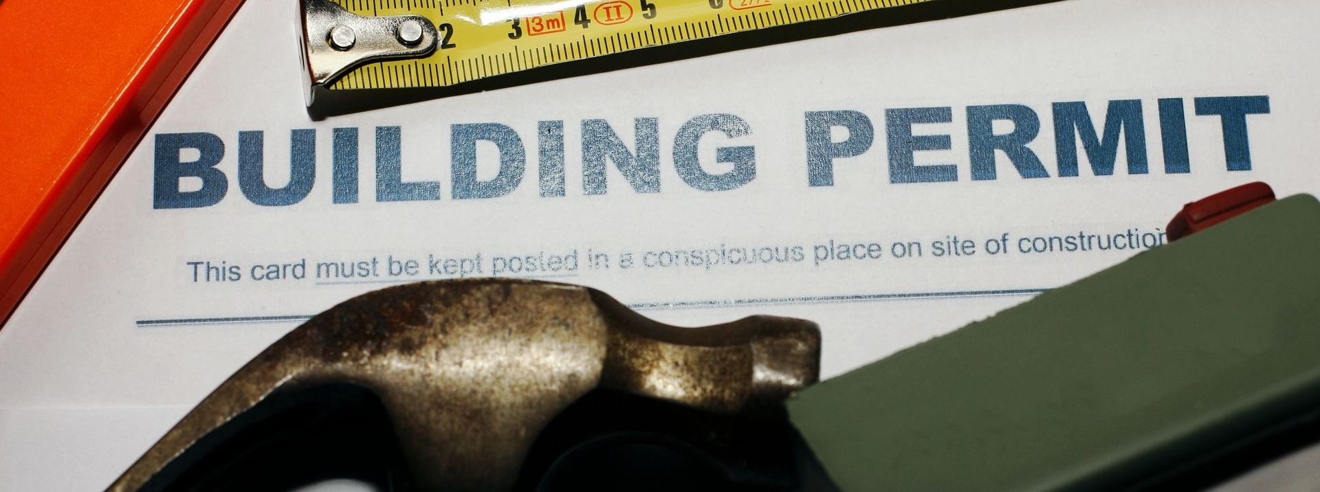 Picture of building permit and carpenter tools