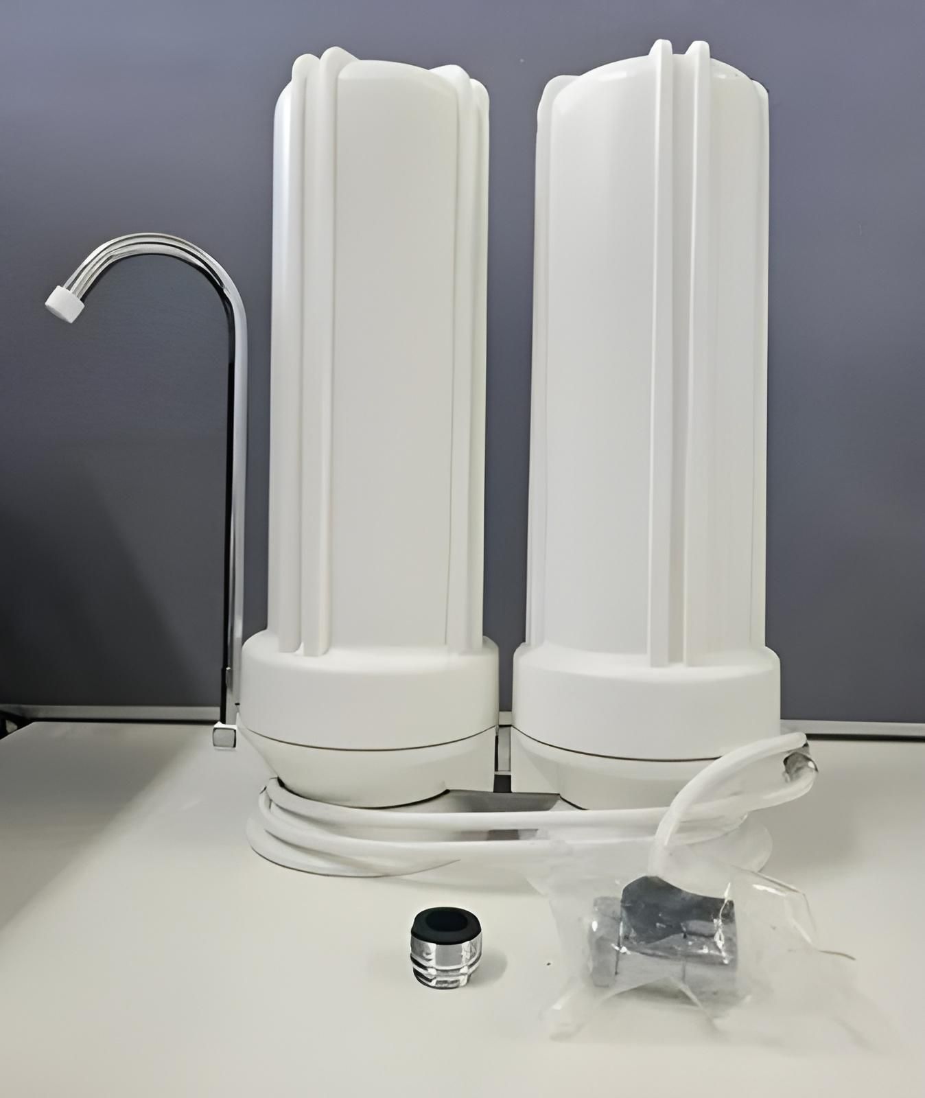 Two White Water Filters Are Sitting on Top of a White Table — NT Water Filters In Winnellie, NT
