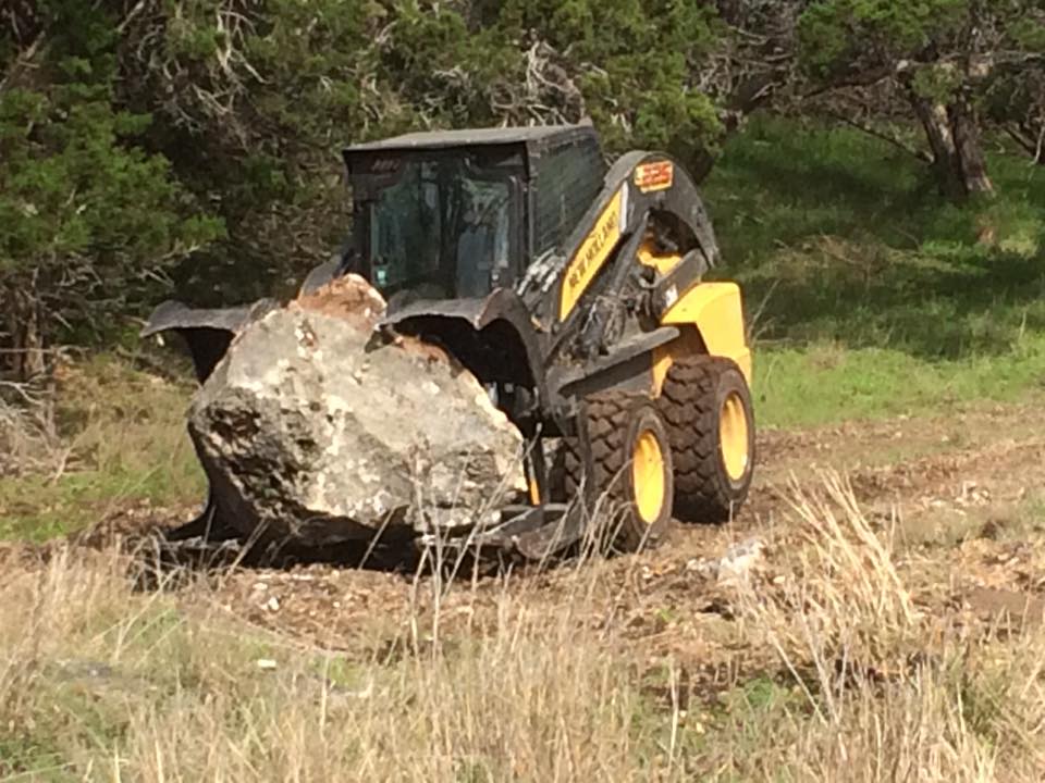 Large rock moving in Boerne TX by Langenberg Specialty Services