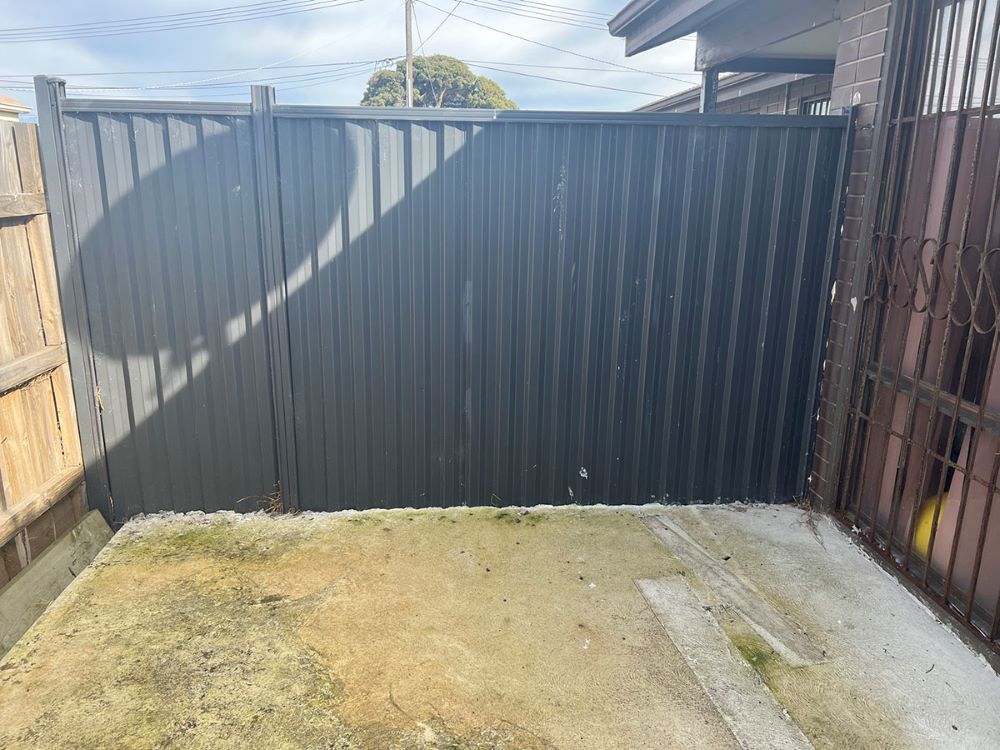 There is a Black Fence in the Backyard of a House — Fig Facility Services in Lara, VIC