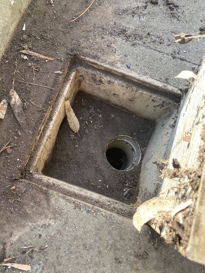 A Drain Hole in the Ground With a Hole in the Middle of It — Fig Facility Services in Lara, VIC