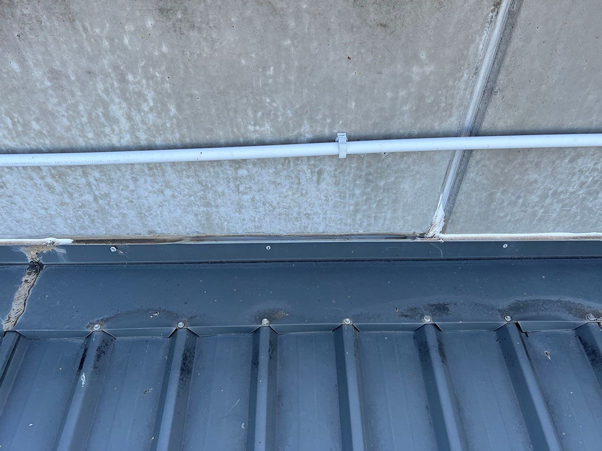 A Close Up of a Roof With a Pipe on It — Fig Facility Services in Lara, VIC