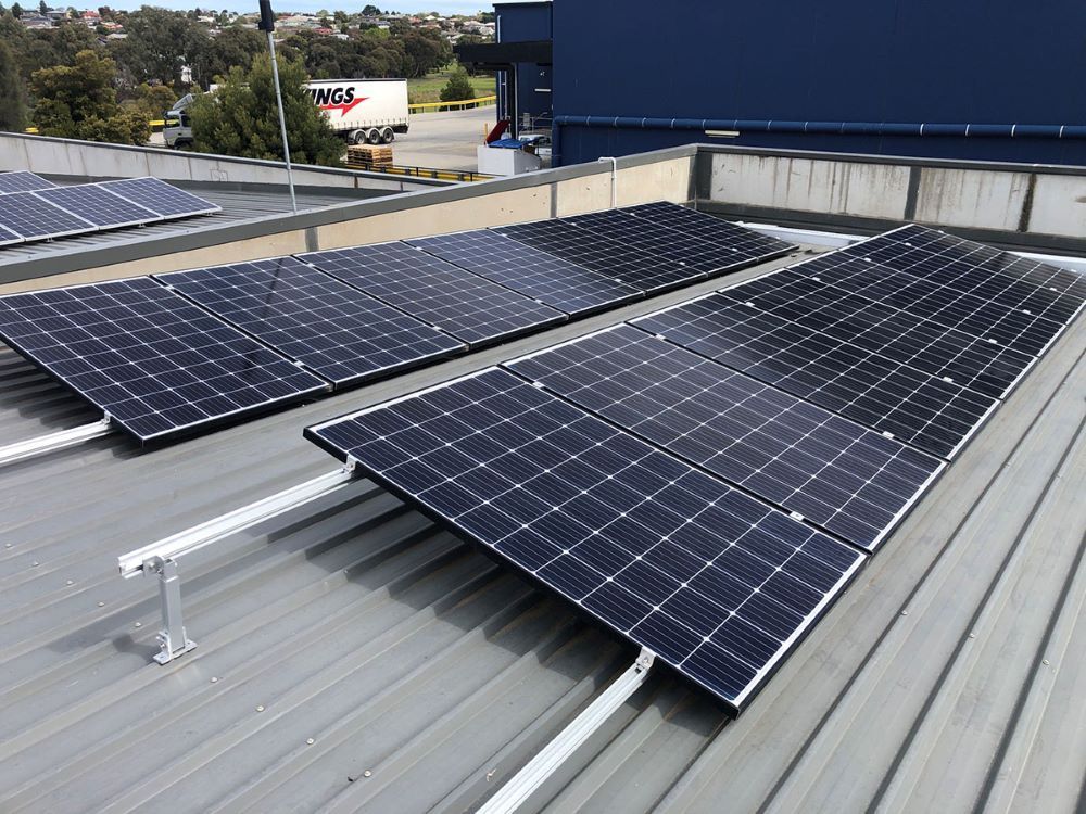 Two Solar Panels Are Sitting on Top of a Roof — Fig Facility Services in Bannockburn, VIC