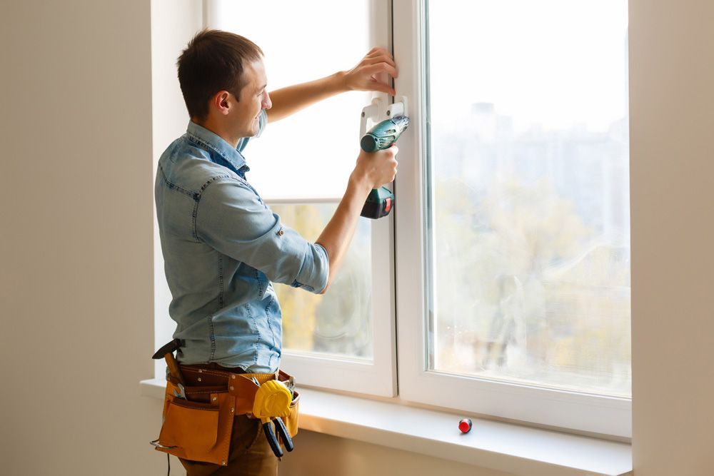 Man Installing Window — Morisset, NSW — Morisset Glass & Glazing