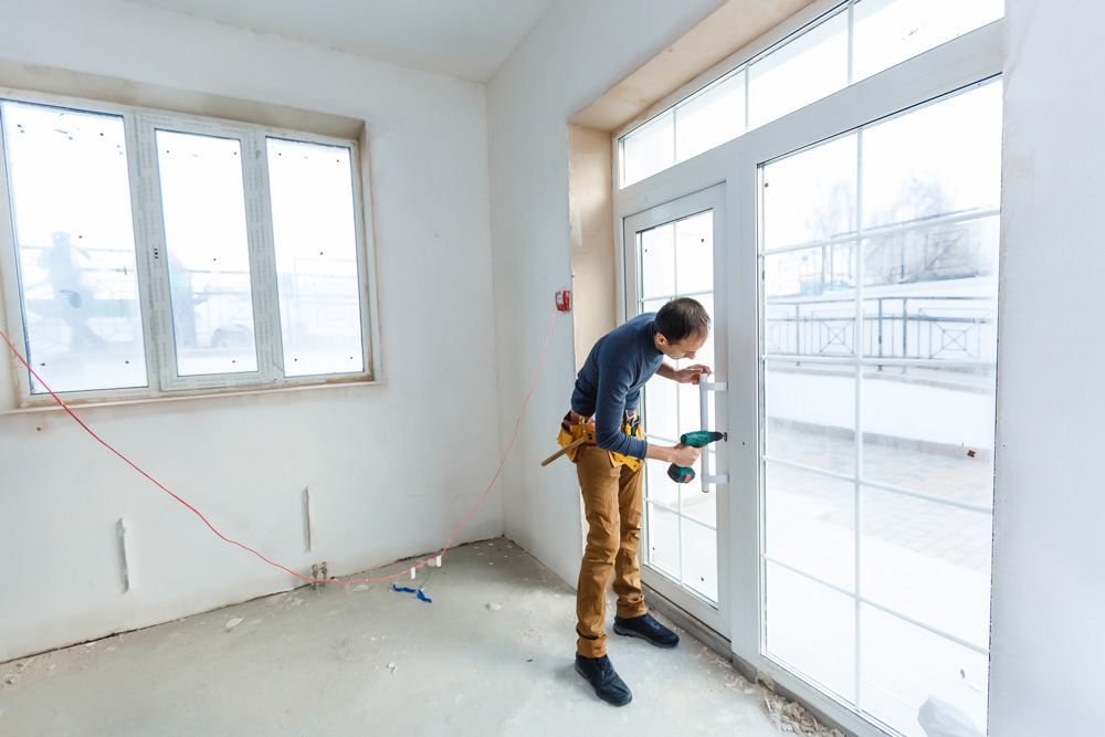 Man Installing Glazier on Workshop — Morisset, NSW — Morisset Glass & Glazing