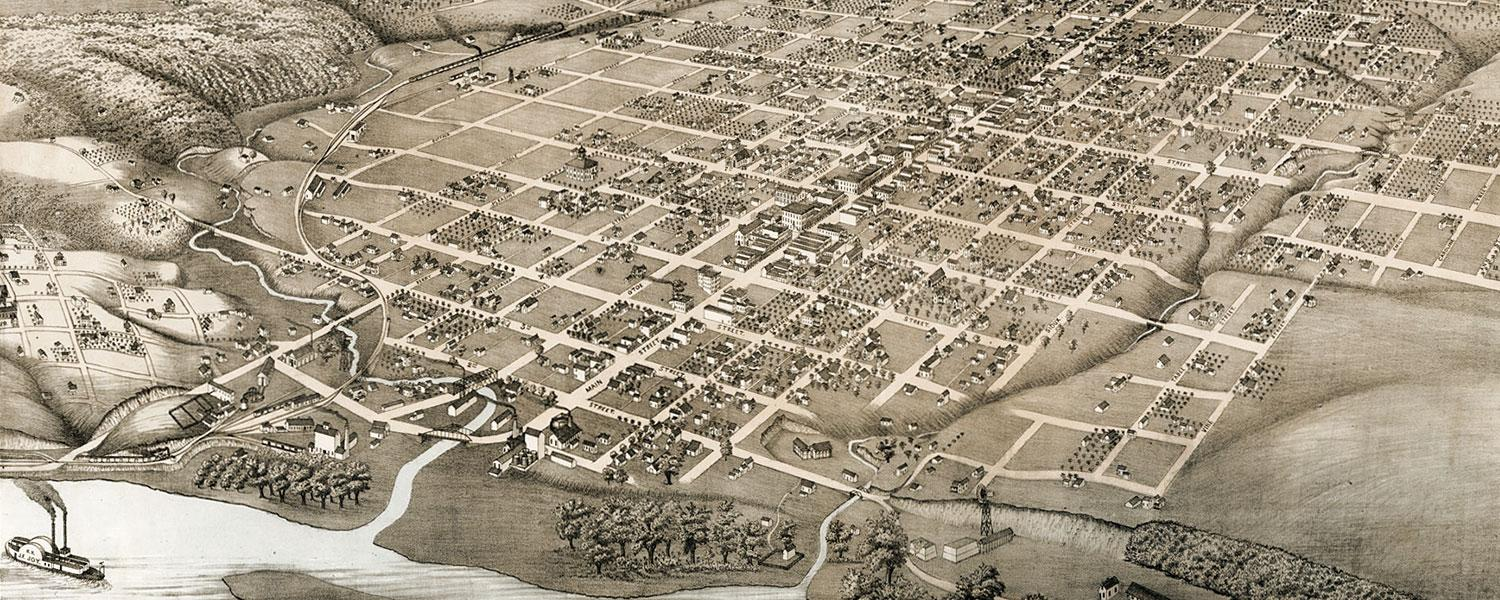 A black and white photo of an aerial view of a city.