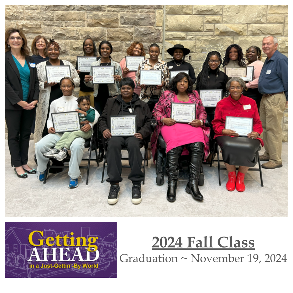 Group of people holding certificates, celebrating a 2024 Fall class graduation.