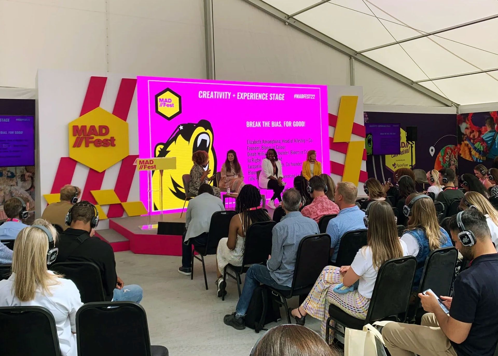 MADfest crowd and stage for a panel on Breaking the Bias
