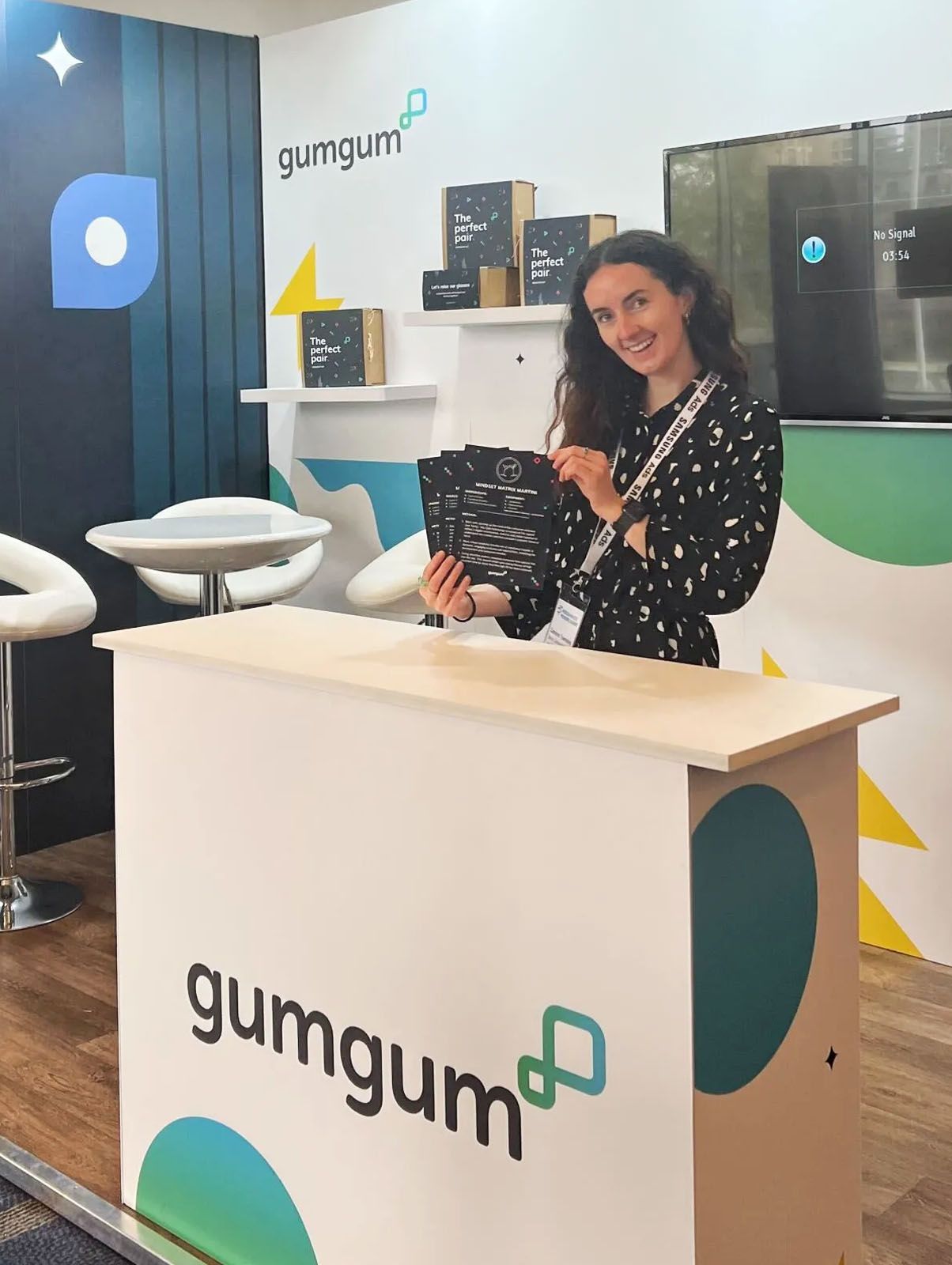 Cameron at a GumGum booth 