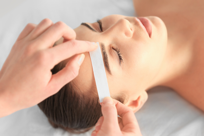 A woman is getting a facial treatment at a spa.