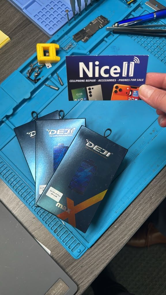 Nicell Cell Phone Repair card with iPhone battery replacement tools and electronics equipment Orem