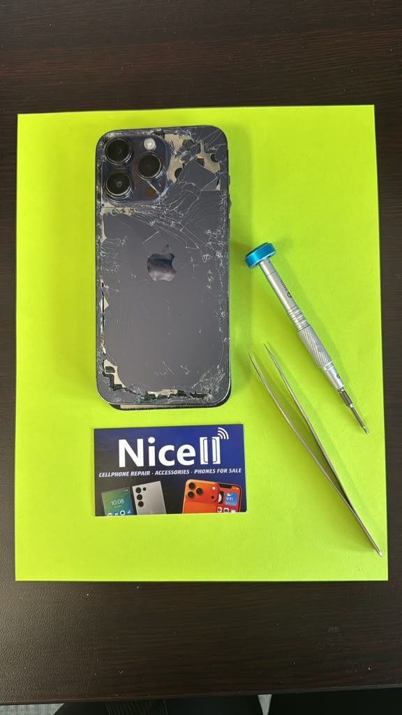Broken black iPhone with repair tools and Nicell Cell Phone Repair box for smartphone repair in Orem