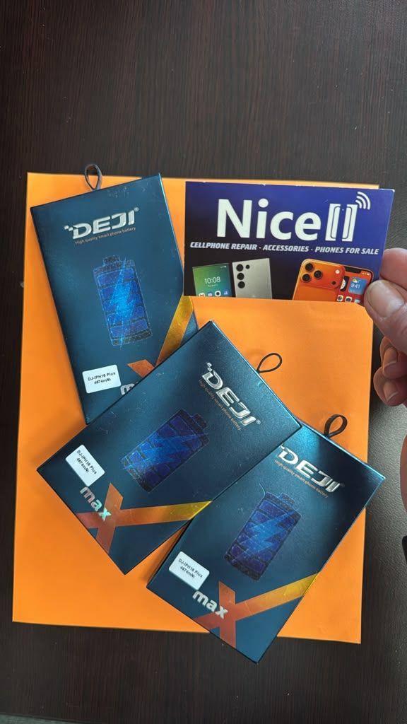 Nicell Cell Phone Repair card with iPhone battery replacement tools and electronics equipment in Orem Utah