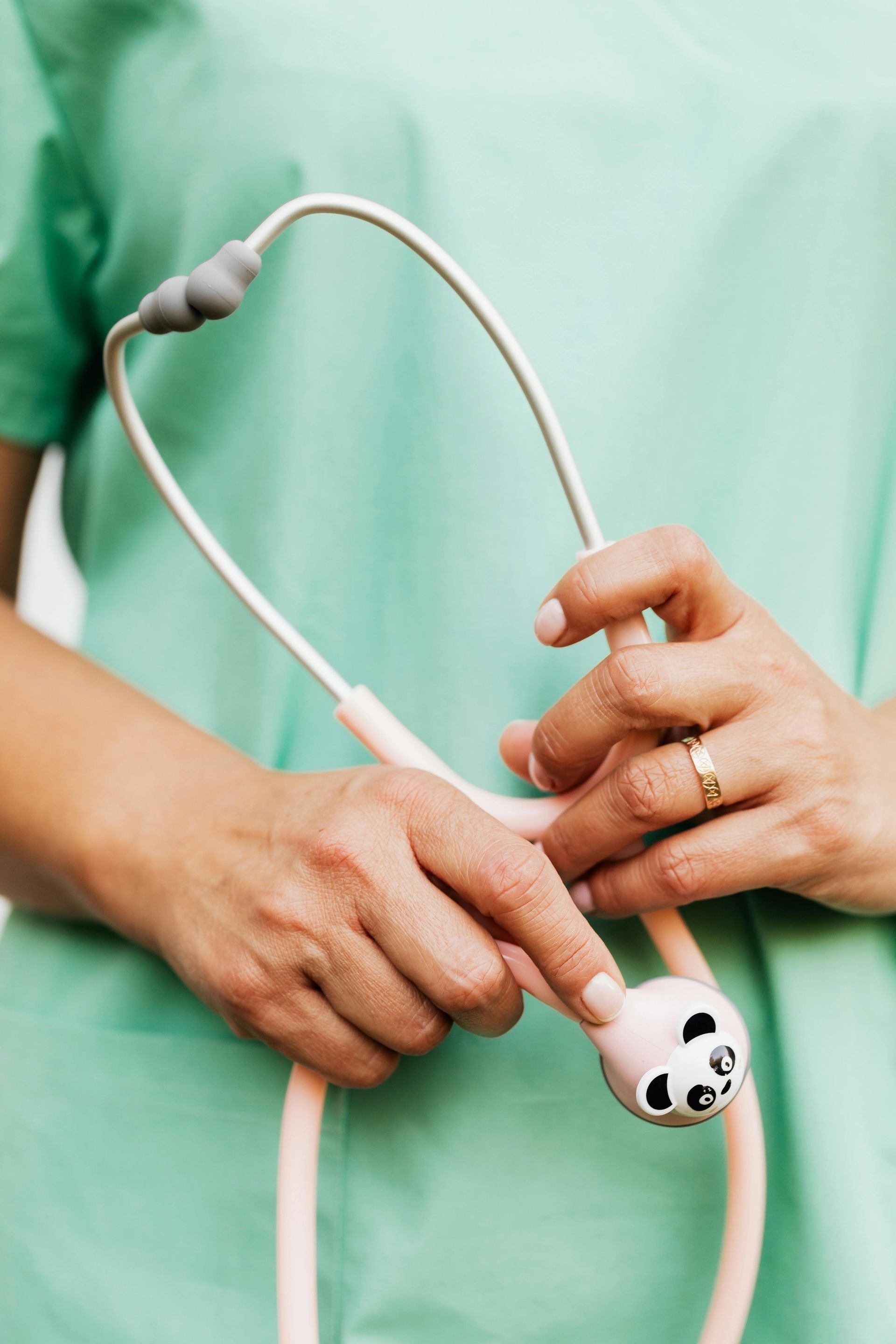 Female pediatrician holding a stethoscope.