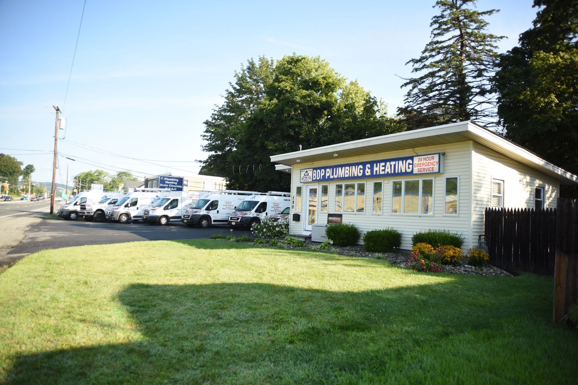 A white business building with a sign that reads 