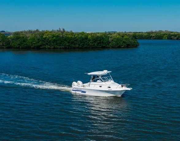 A boat floating on top of a large body of water.